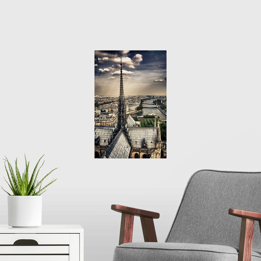 A modern room featuring Fine art photograph of the top spire of the cathedral, overlooking the Seine river and the Ile-de...