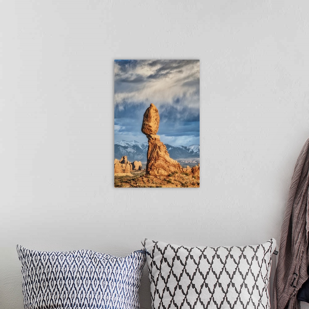A bohemian room featuring Balanced Rock in Arches National Park at sunset