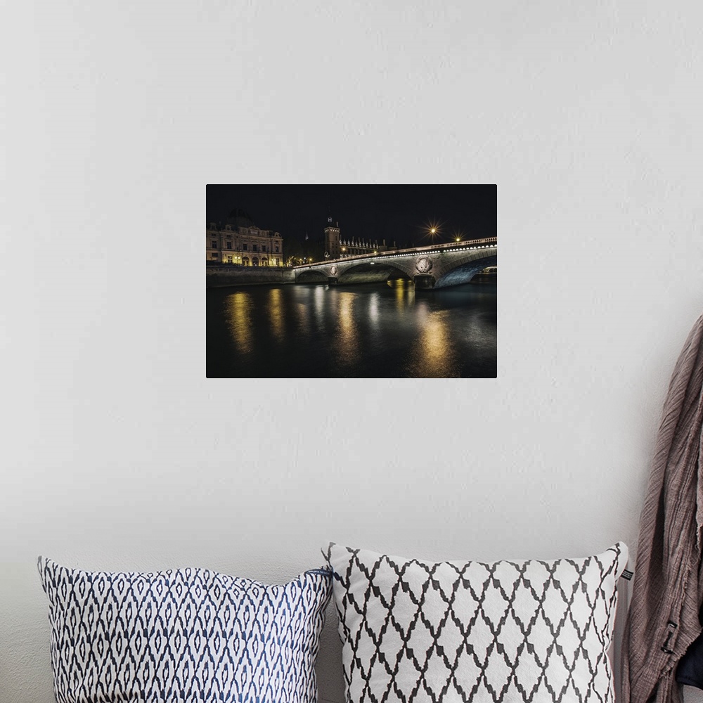 A bohemian room featuring Bridge across the Seine at night in Paris, France