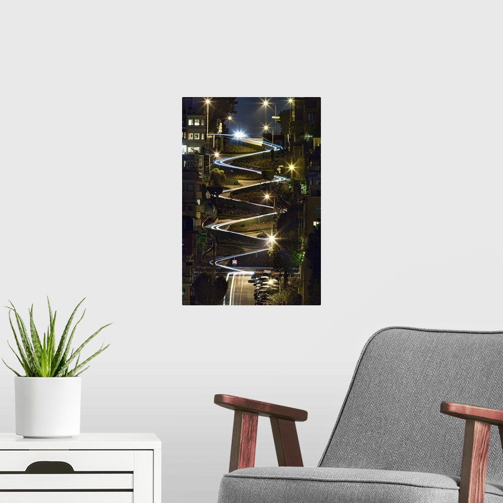 A modern room featuring The lights from cars during the evening on Lombard Street in San Francisco, California.