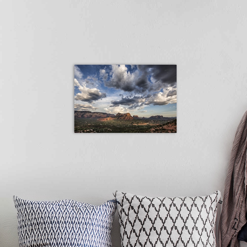 A bohemian room featuring Clouds and red rocks at sunset in Sedona, Arizona.