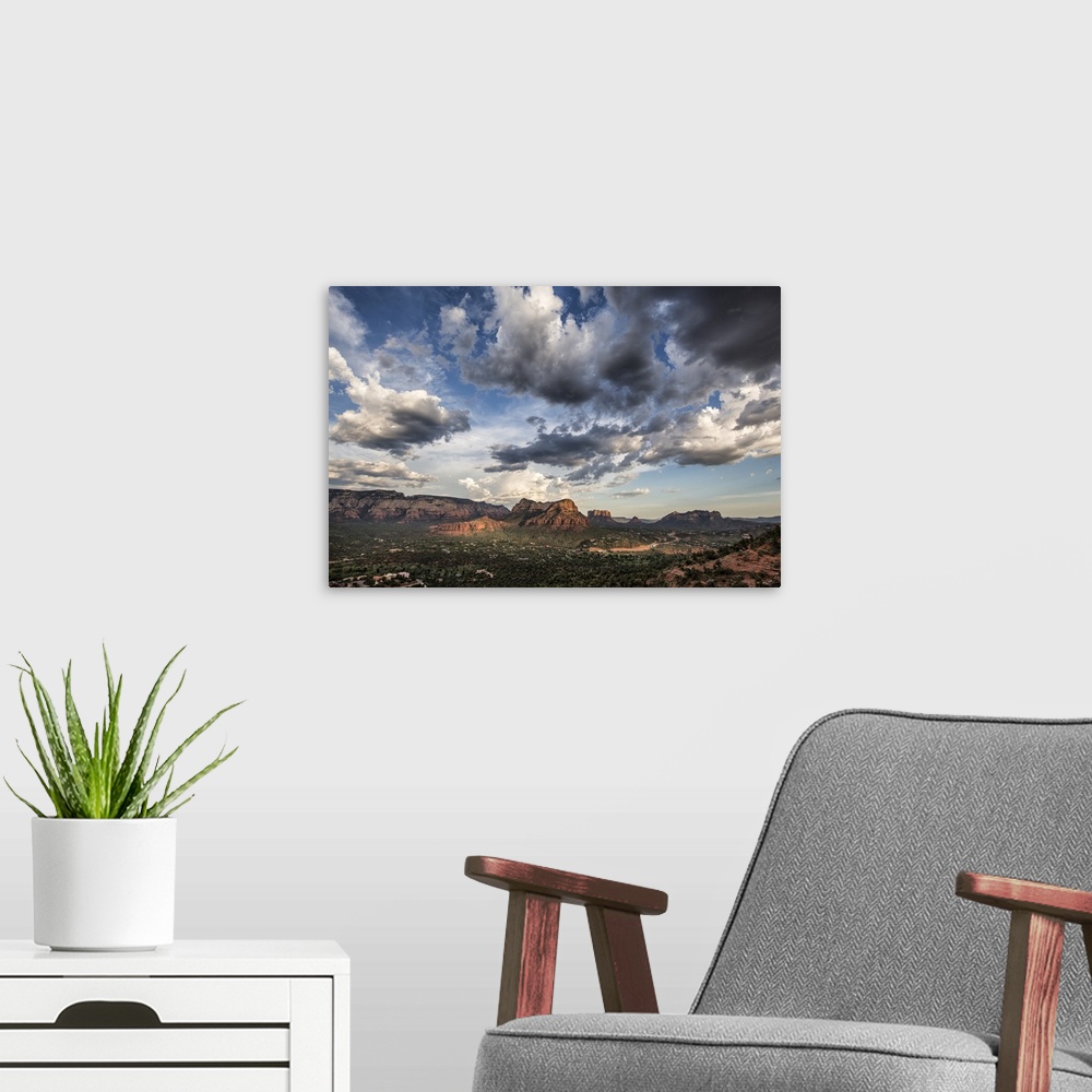 A modern room featuring Clouds and red rocks at sunset in Sedona, Arizona.