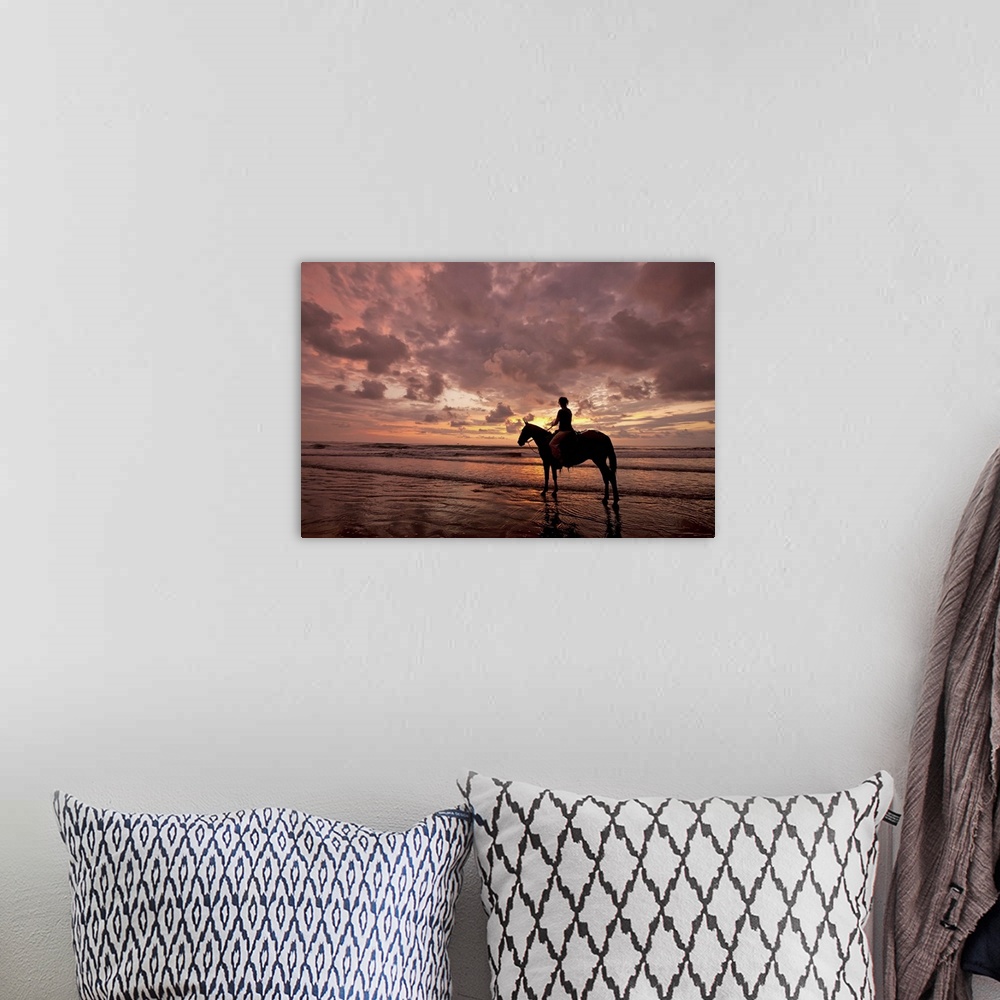 A bohemian room featuring Colorful sunset on the beach with horse and rider