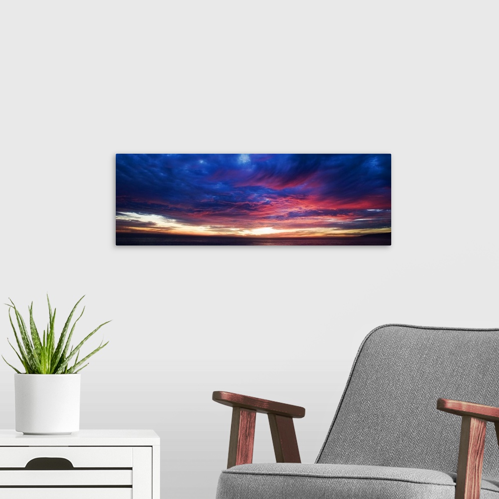 A modern room featuring Colorful sunset over Malibu, California