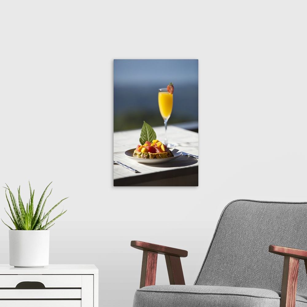 A modern room featuring Fruit and a mimosa in a restaurant with a view of the ocean, Costa Rica