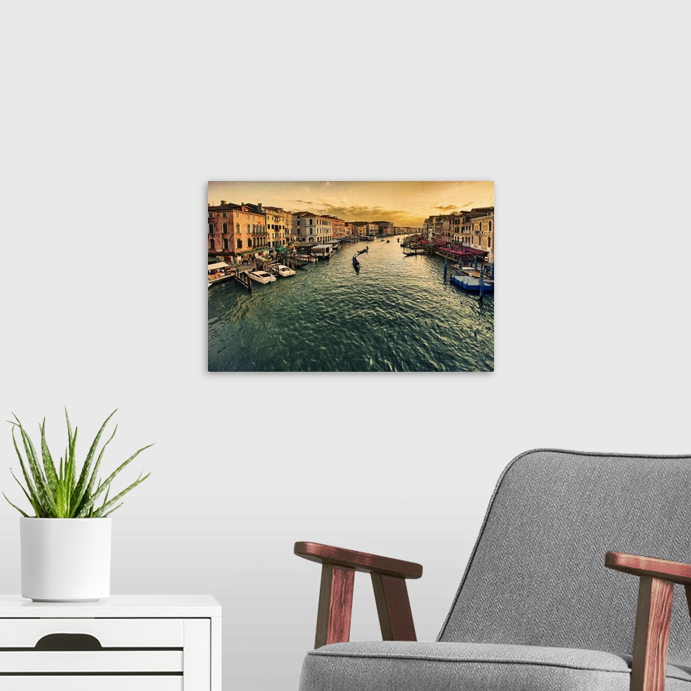 A modern room featuring Big canvas photo of gondolas floating down a canal with buildings lining the water on either side.