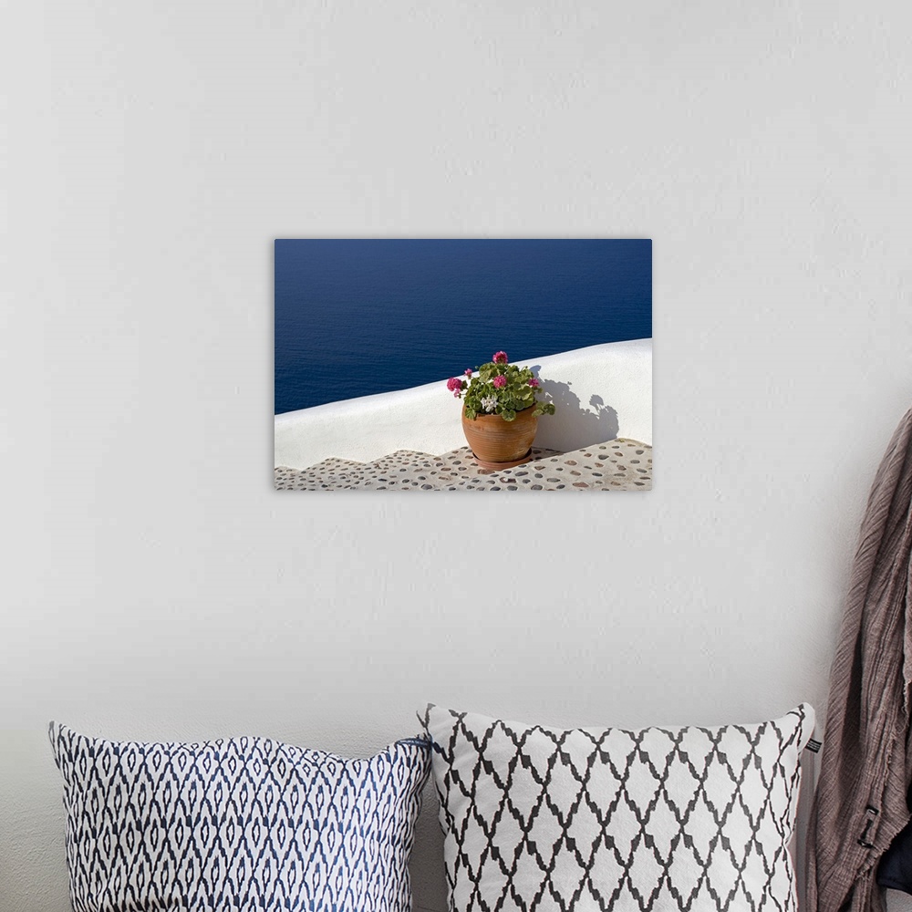 A bohemian room featuring Greek Flowers over the sea