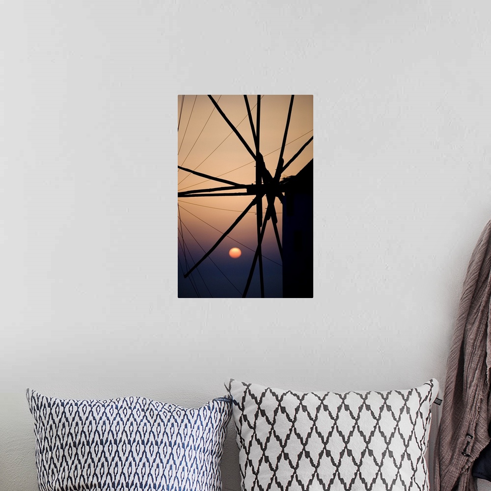 A bohemian room featuring Giant, vertical, close up photograph of the spokes of a windmill at sunset, in Mykonos, Greece.