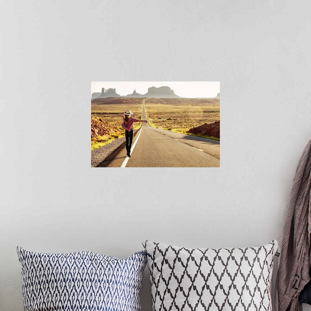 A bohemian room featuring Hitchhiker on Forrest Gump highway by Monument Valley, Arizona