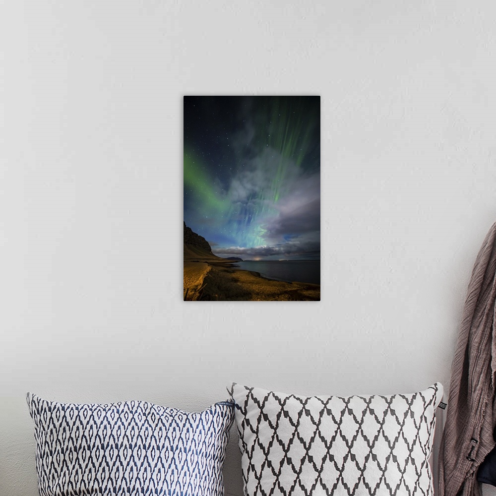 A bohemian room featuring Aurora borealis above the coast in Iceland.