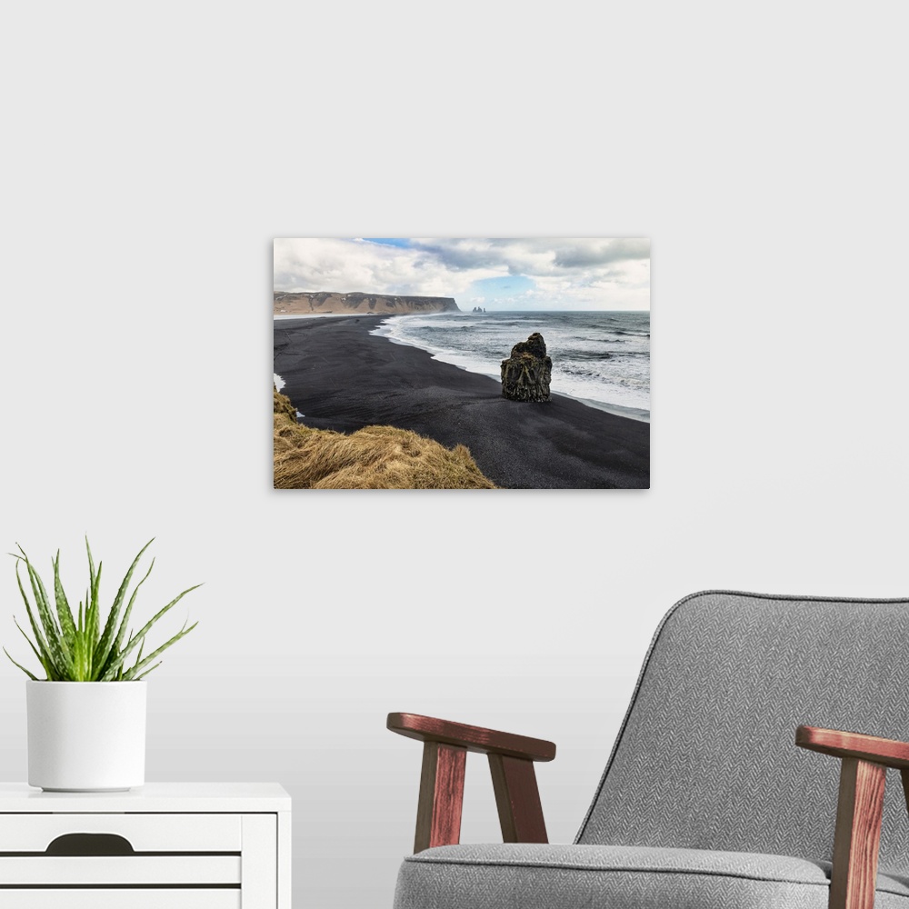 A modern room featuring Reynisfjara black sand beach near Vik, Iceland.