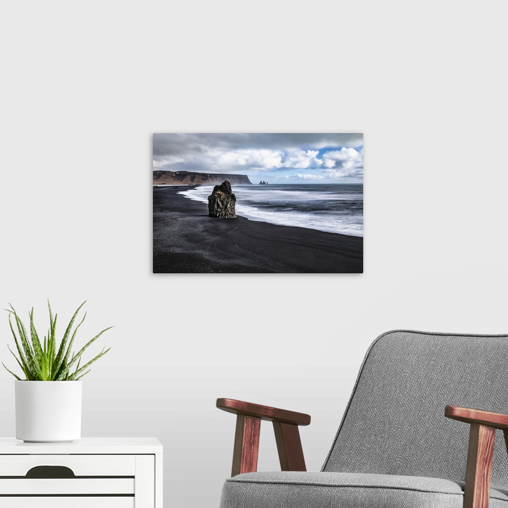 A modern room featuring Reynisfjara black sand beach near Vik, Iceland.