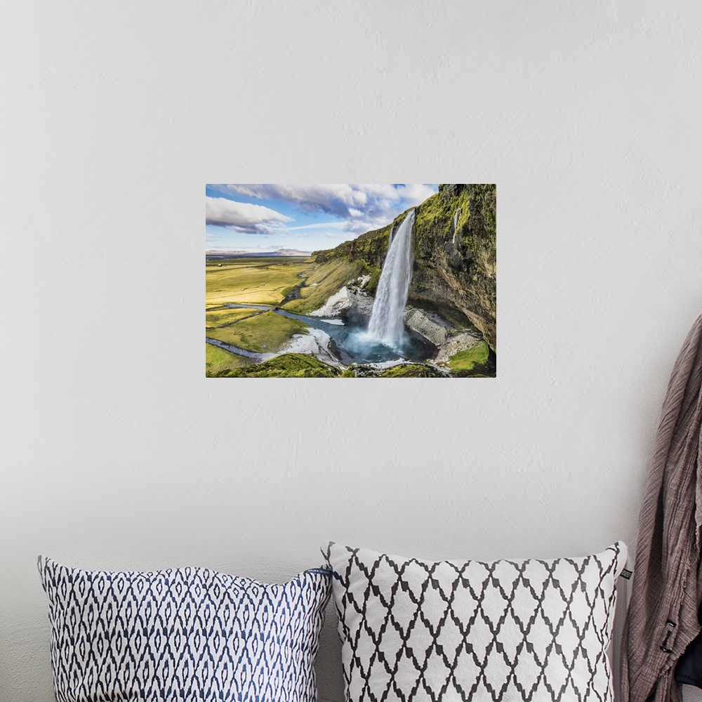 A bohemian room featuring Seljalandsfoss waterfall in south Iceland.