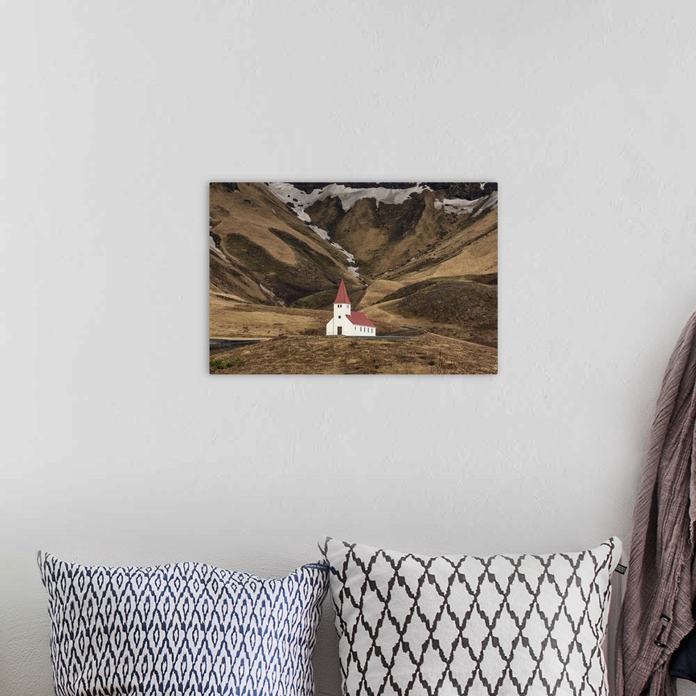 A bohemian room featuring The beautiful church on the hillside in Vik, Iceland.