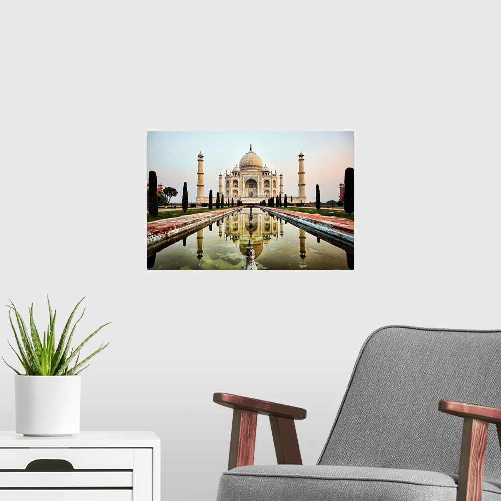 A modern room featuring Photograph of an ornate marble mausoleum.  A reflection pool is located in front lined with tall ...