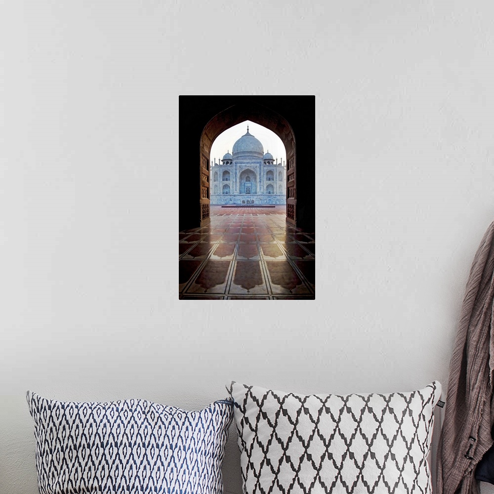 A bohemian room featuring Photograph taken of the Taj Mahal through an archway.