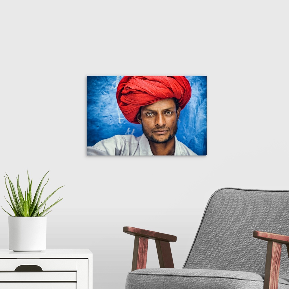 A modern room featuring Man with red turban in the Blue City of Jodhpur, India.