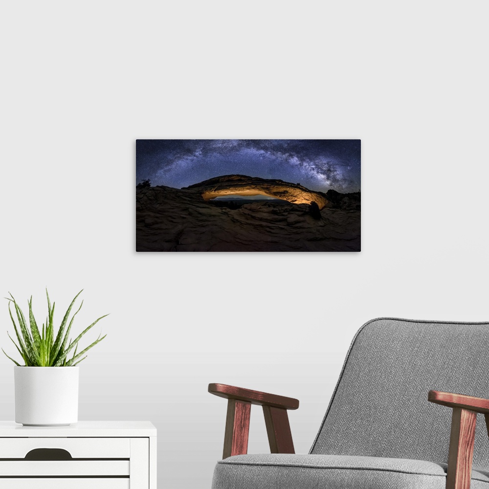 A modern room featuring Milky Way panorama over Mesa Arch in Canyondlands National Park.