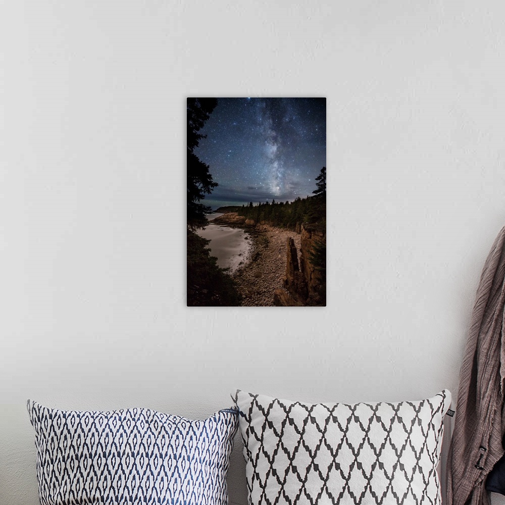 A bohemian room featuring Monument Cove and the Milky Way in Acadia National Park.