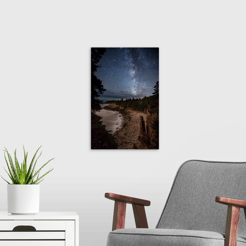 A modern room featuring Monument Cove and the Milky Way in Acadia National Park.