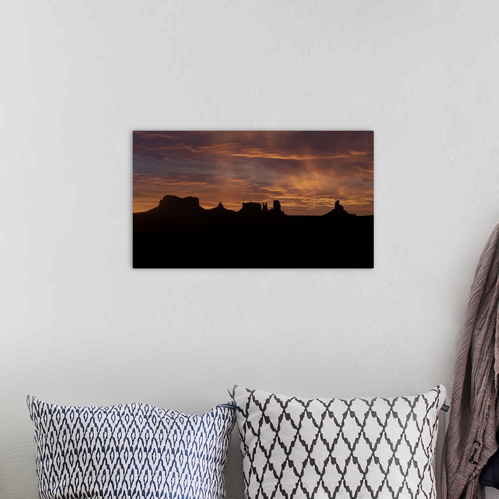 A bohemian room featuring Monument Valley at sunrise