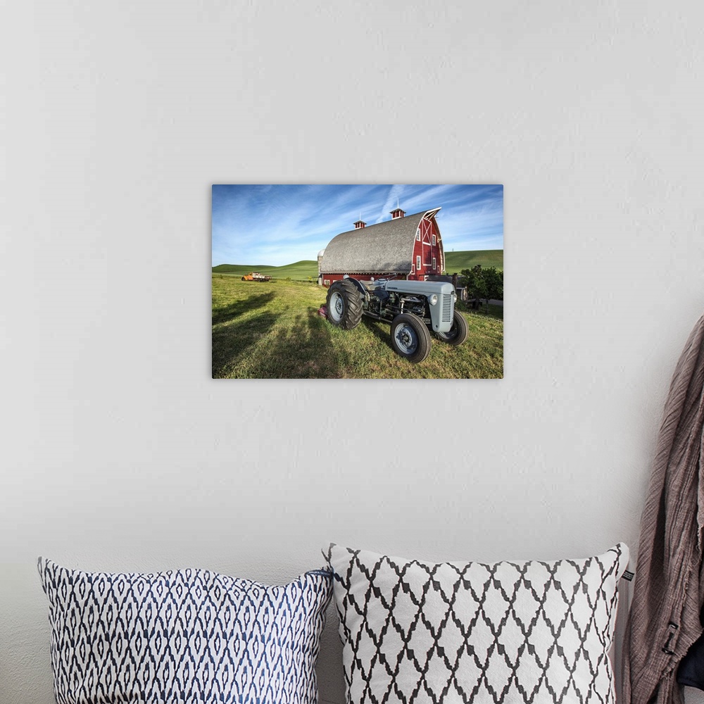 A bohemian room featuring Old tractor and red barn in the Palouse, Washington