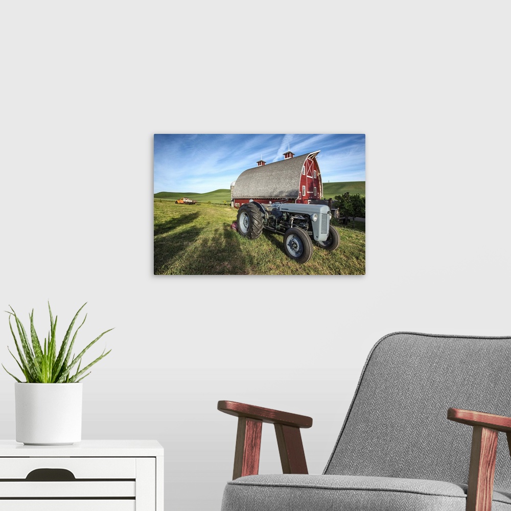 A modern room featuring Old tractor and red barn in the Palouse, Washington