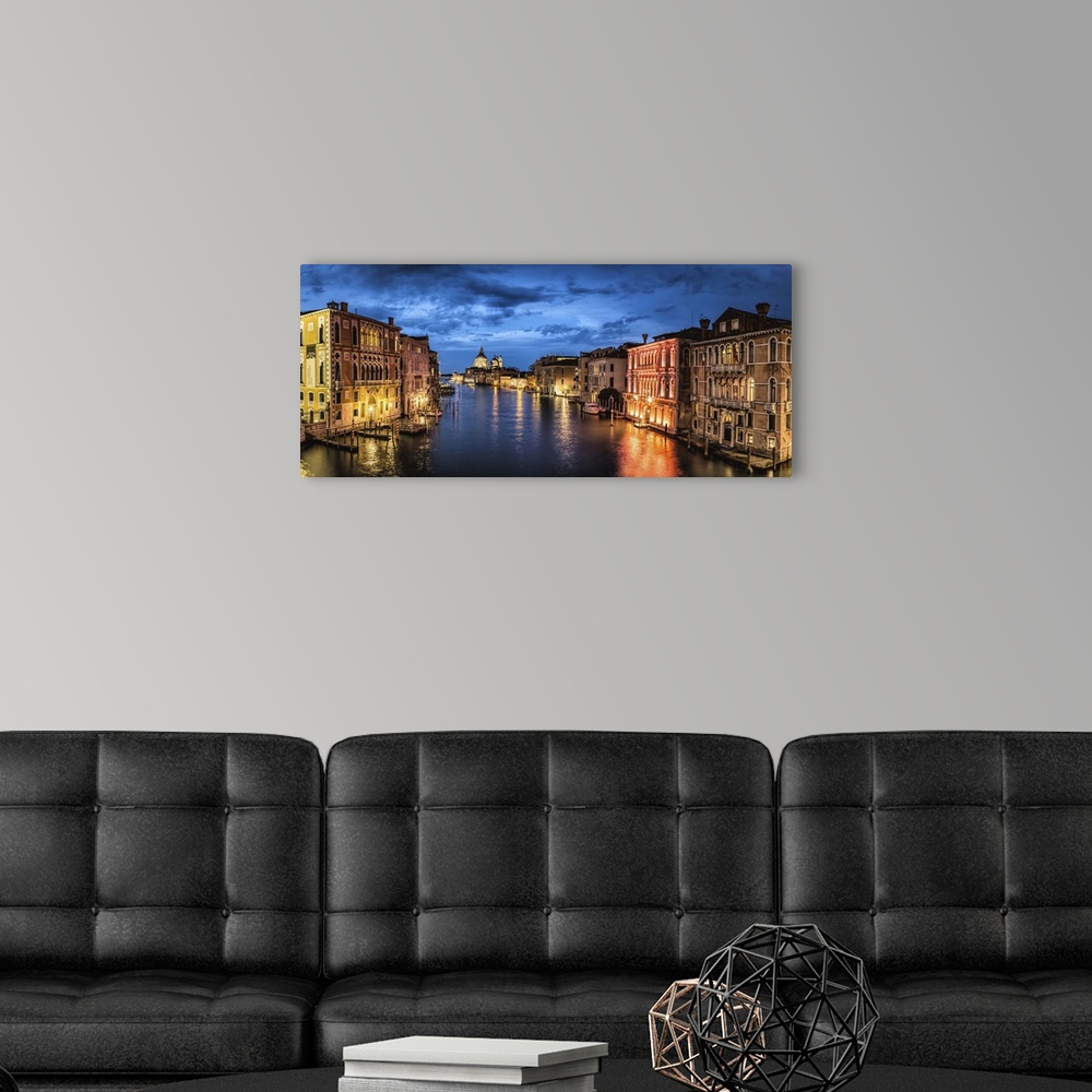A modern room featuring Panorama from the Academia Bridge after dark in Venice, Italy.