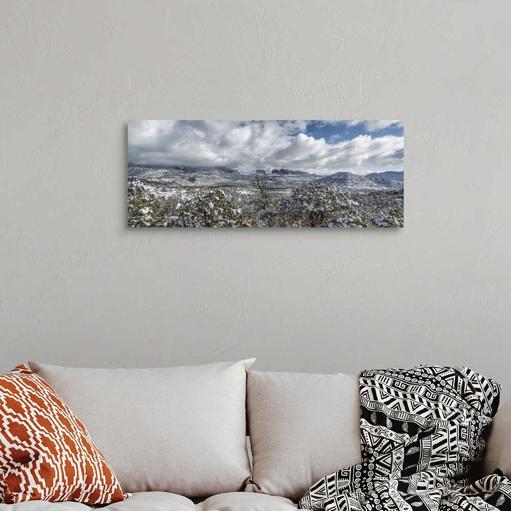 A bohemian room featuring Panorama of the red rocks of Sedona, Arizona covered in snow.