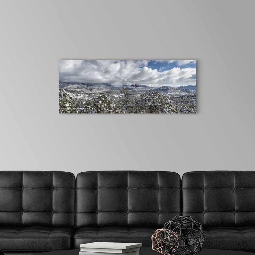 A modern room featuring Panorama of the red rocks of Sedona, Arizona covered in snow.