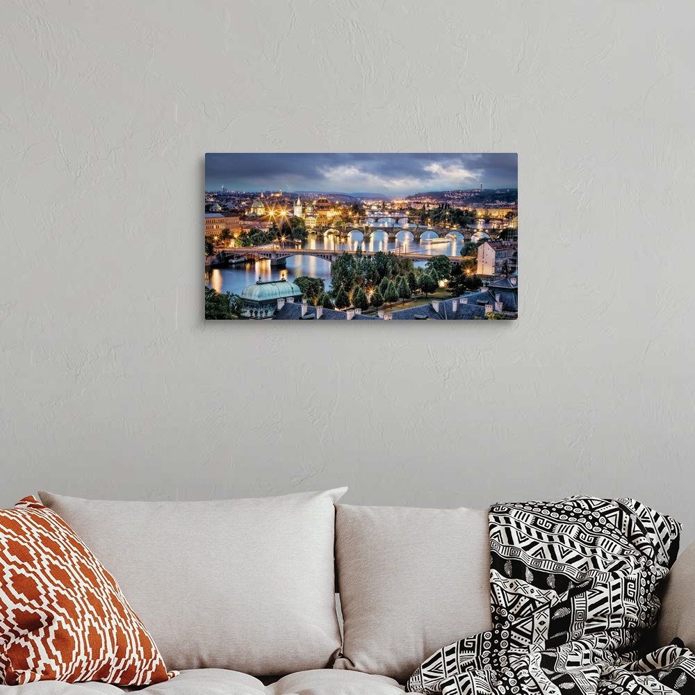 A bohemian room featuring Panorama of Vltava River and bridges in Prague at sunset