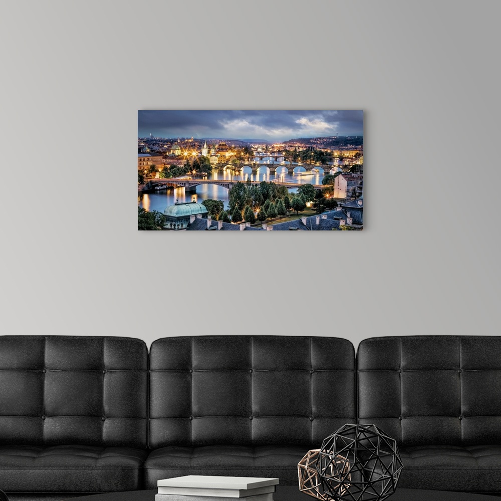 A modern room featuring Panorama of Vltava River and bridges in Prague at sunset