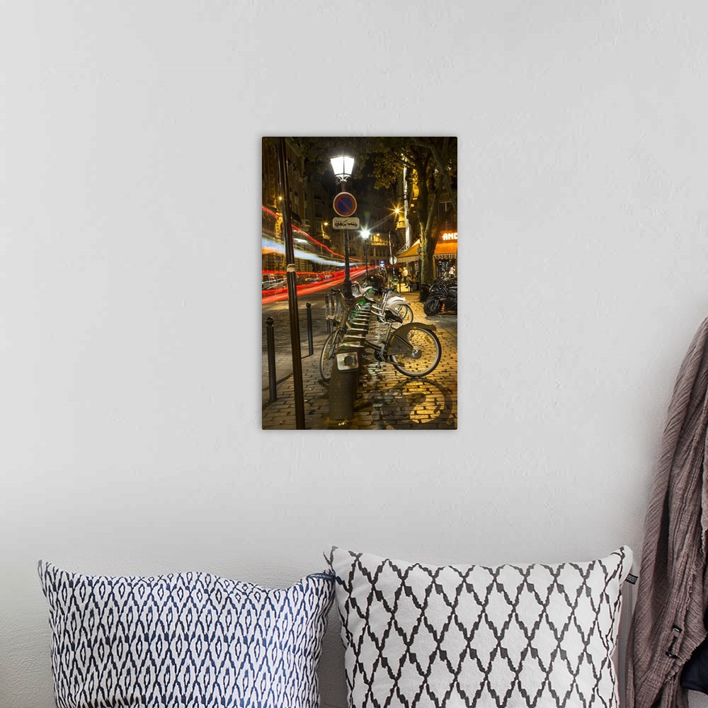 A bohemian room featuring Paris street with car trails at night