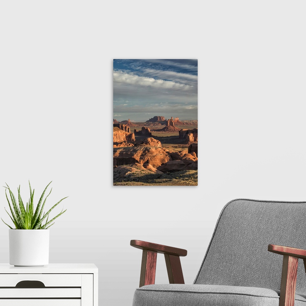 A modern room featuring Picturesque Hunts Mesa rock formation in Monument Valley, Arizona