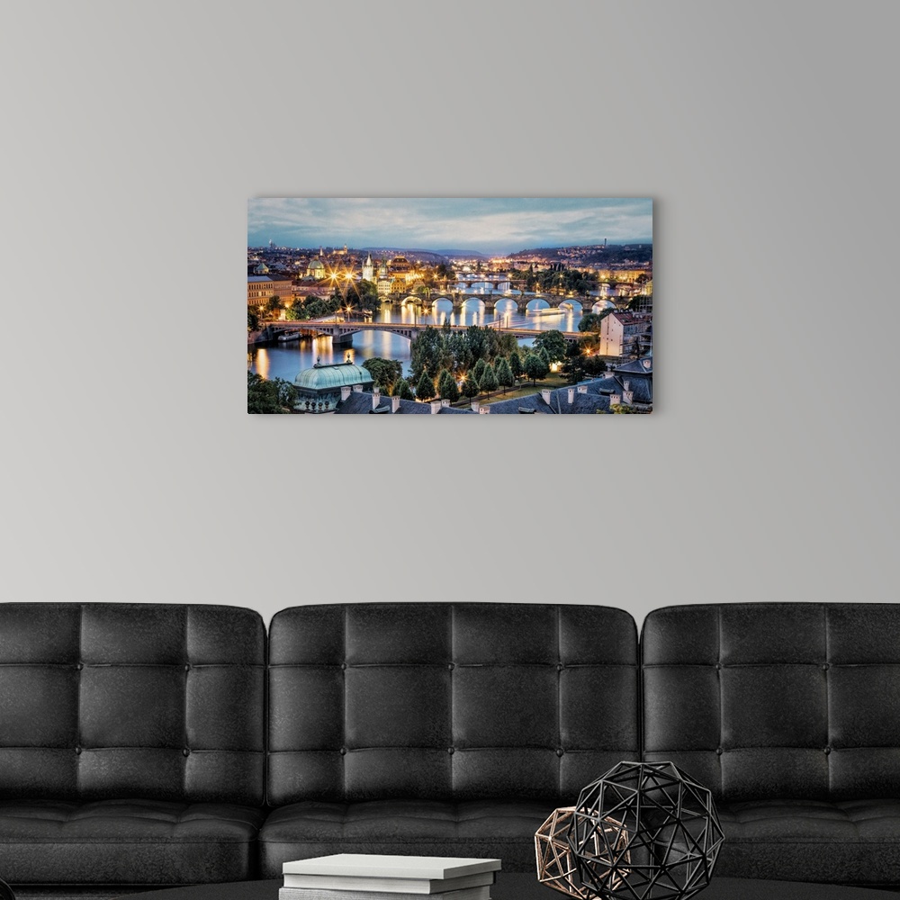 A modern room featuring Panorama of Vltava River and bridges in Prague at sunset.