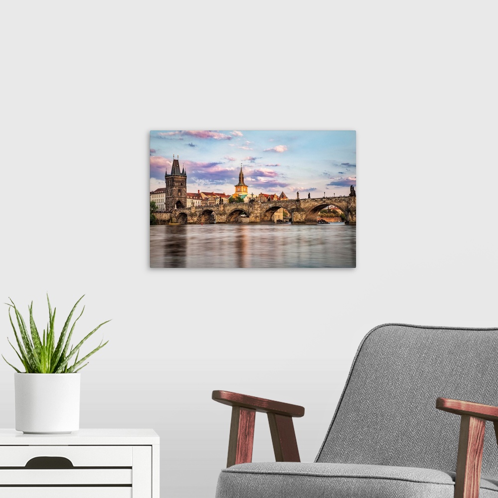 A modern room featuring The Charles Bridge and Prague at sunrise.