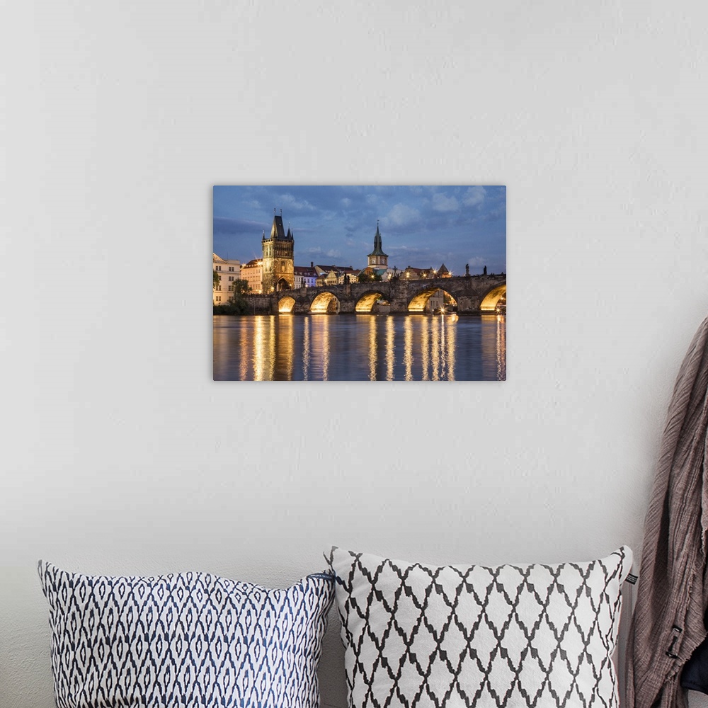 A bohemian room featuring The stunning Charles Bridge and Prague at sunset.