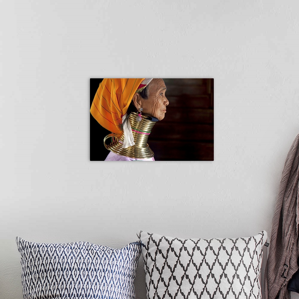 A bohemian room featuring Profile of a Padaung ring neck woman in Inle Lake, Burma