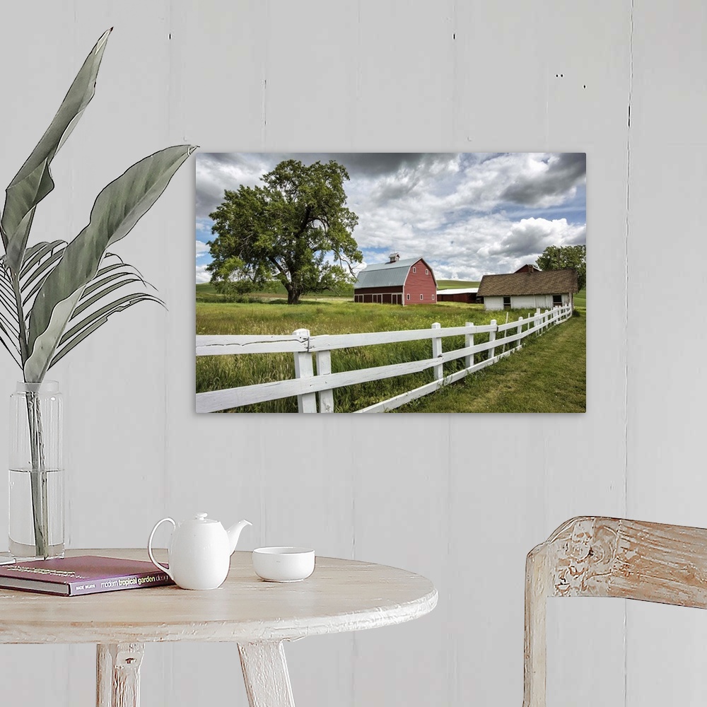 A farmhouse room featuring Red barn and white picket fence in the Palouse, Washington