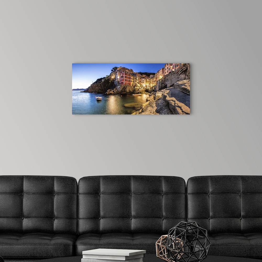 A modern room featuring Riomaggiore in the Cinque Terre at sunset.
