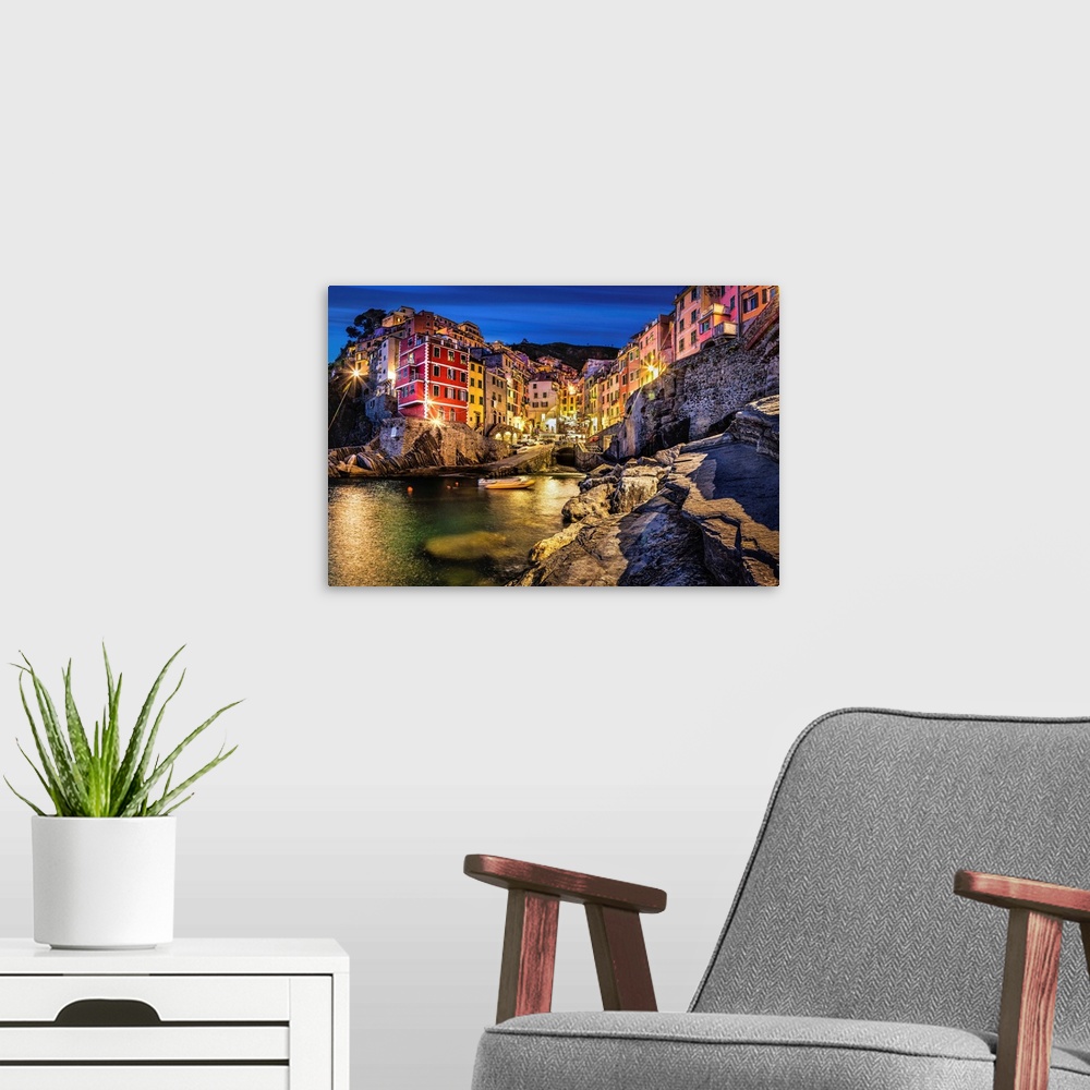 A modern room featuring Riomaggiore in the Cinque Terre at sunset