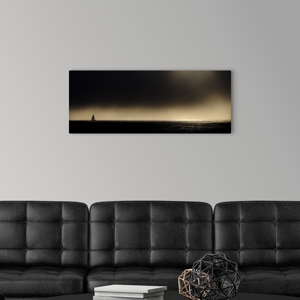 A modern room featuring Sailboat at sunset off the coast of California