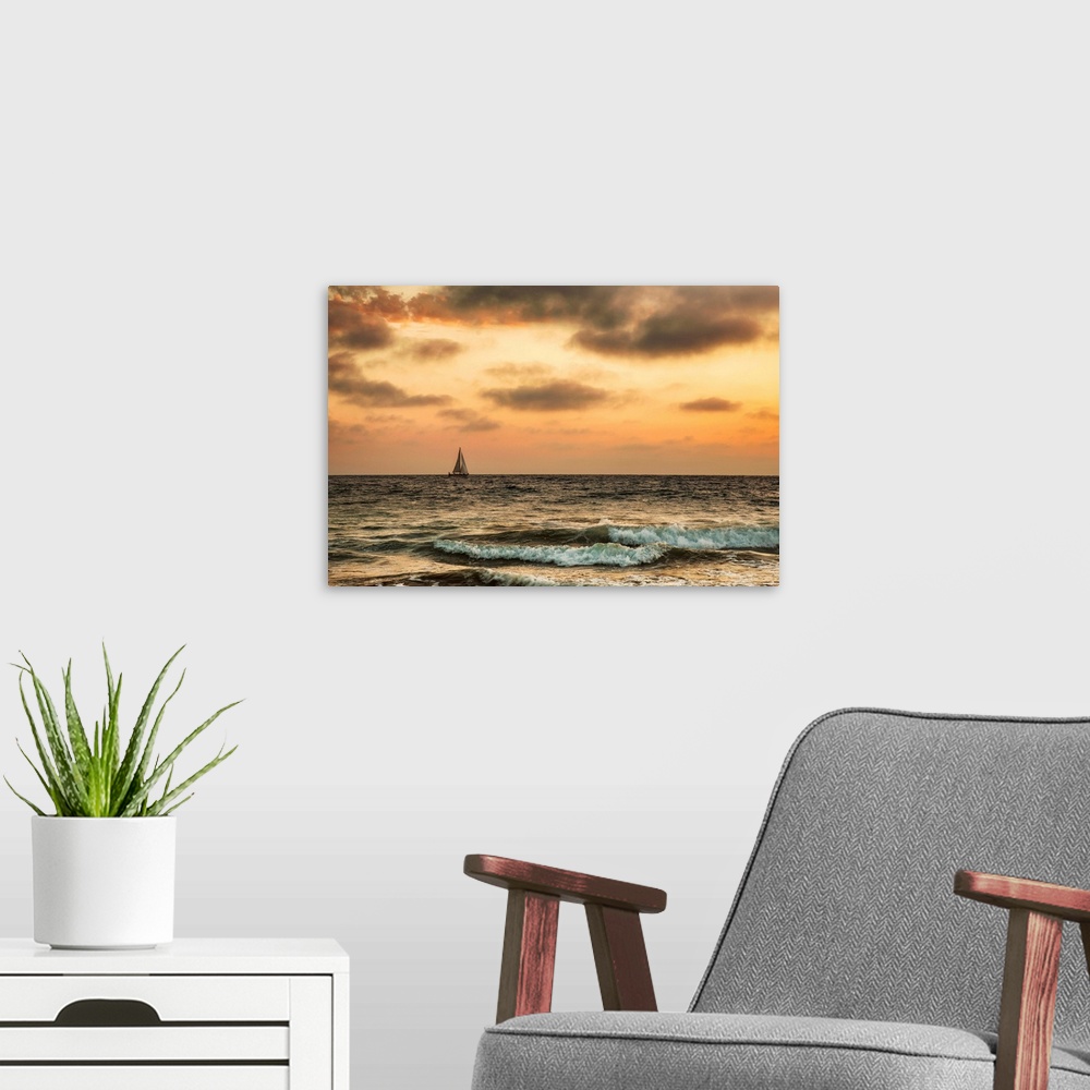 A modern room featuring Sailboat off the coast of California at sunset.