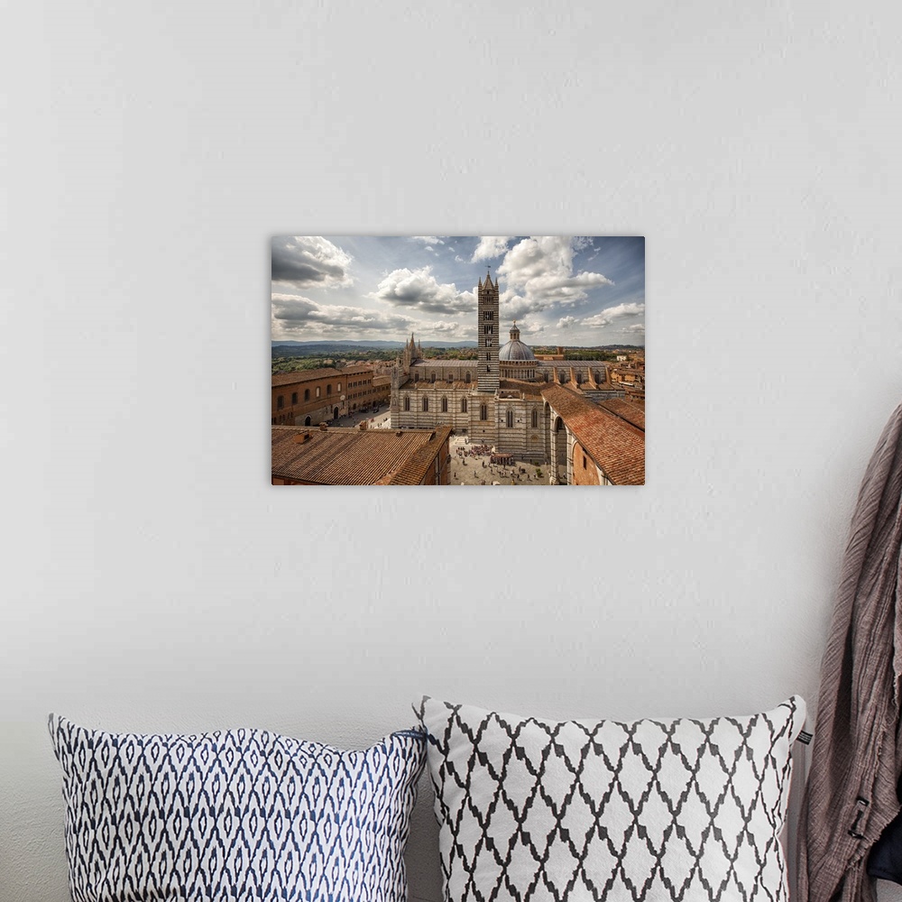 A bohemian room featuring Siena, Italy from above