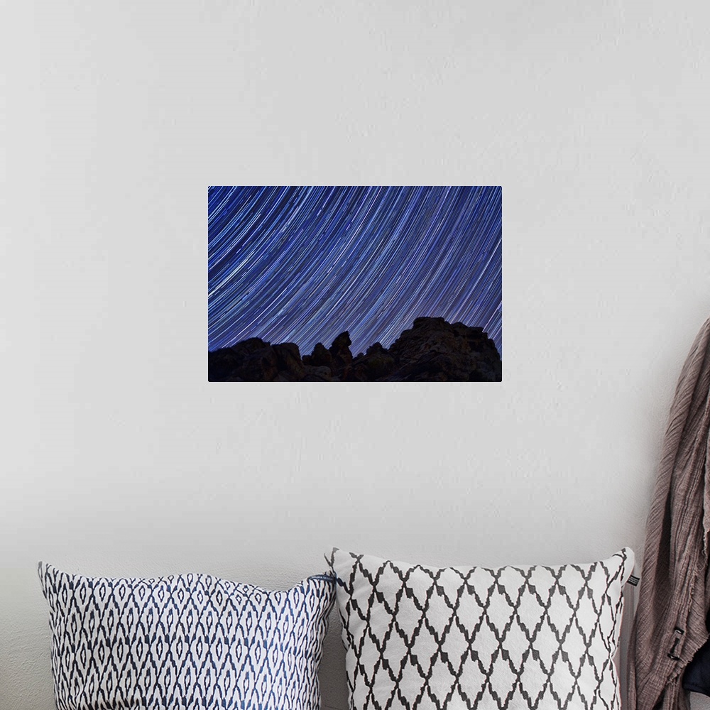 A bohemian room featuring Star trails in the sky over Death Valley, California.