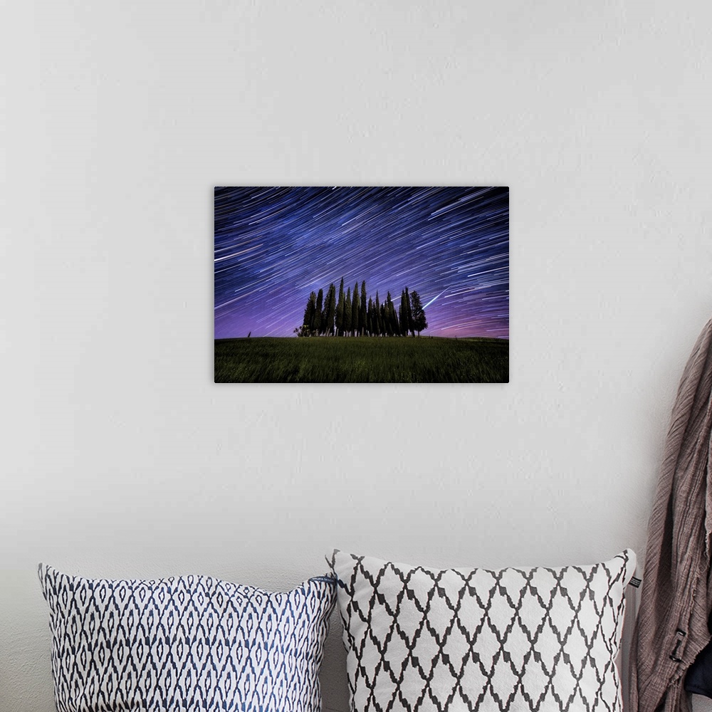 A bohemian room featuring Star trails over Italian Cypress in Val D'Orcia, Tuscany
