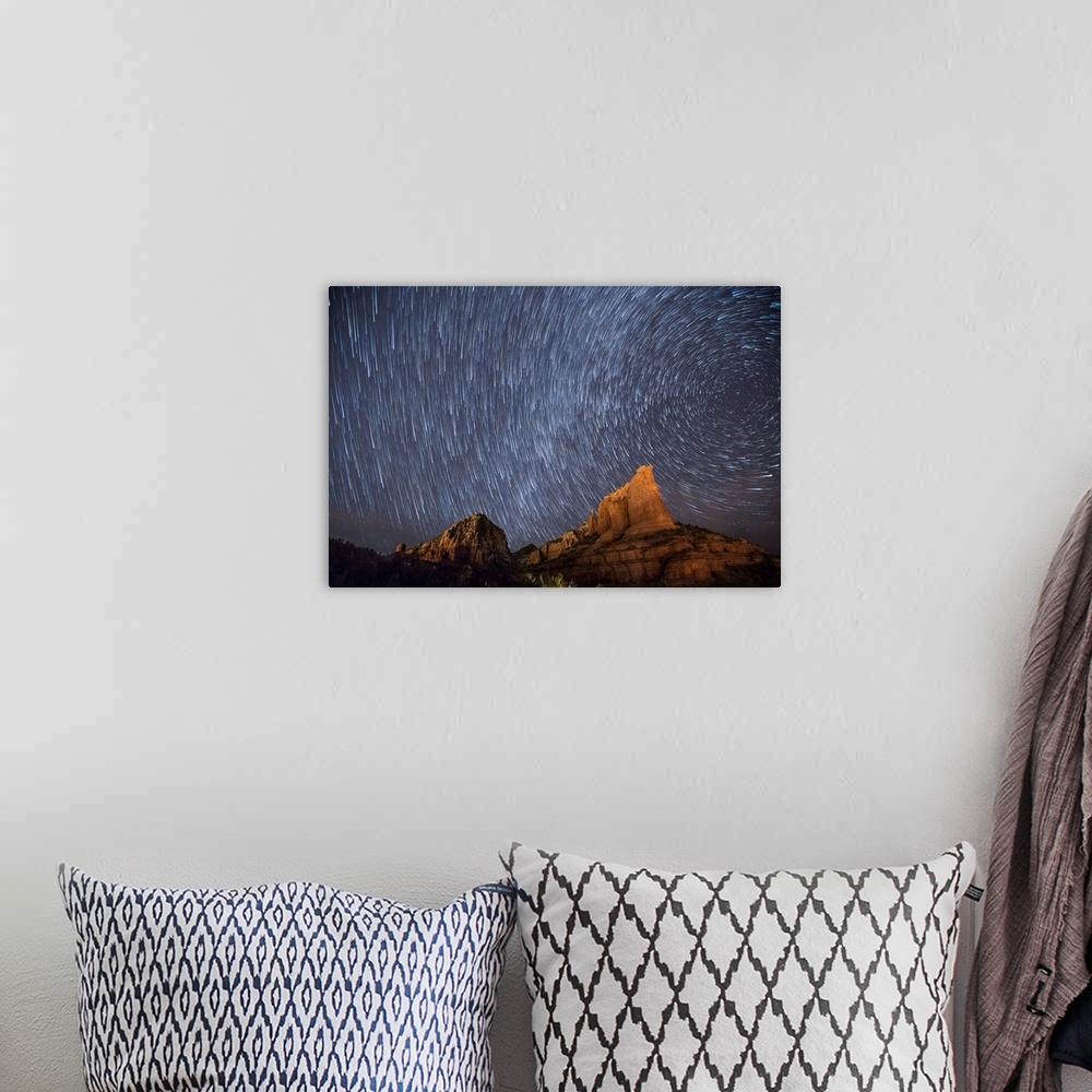 A bohemian room featuring Star trails over the red rocks of Sedona, Arizona.