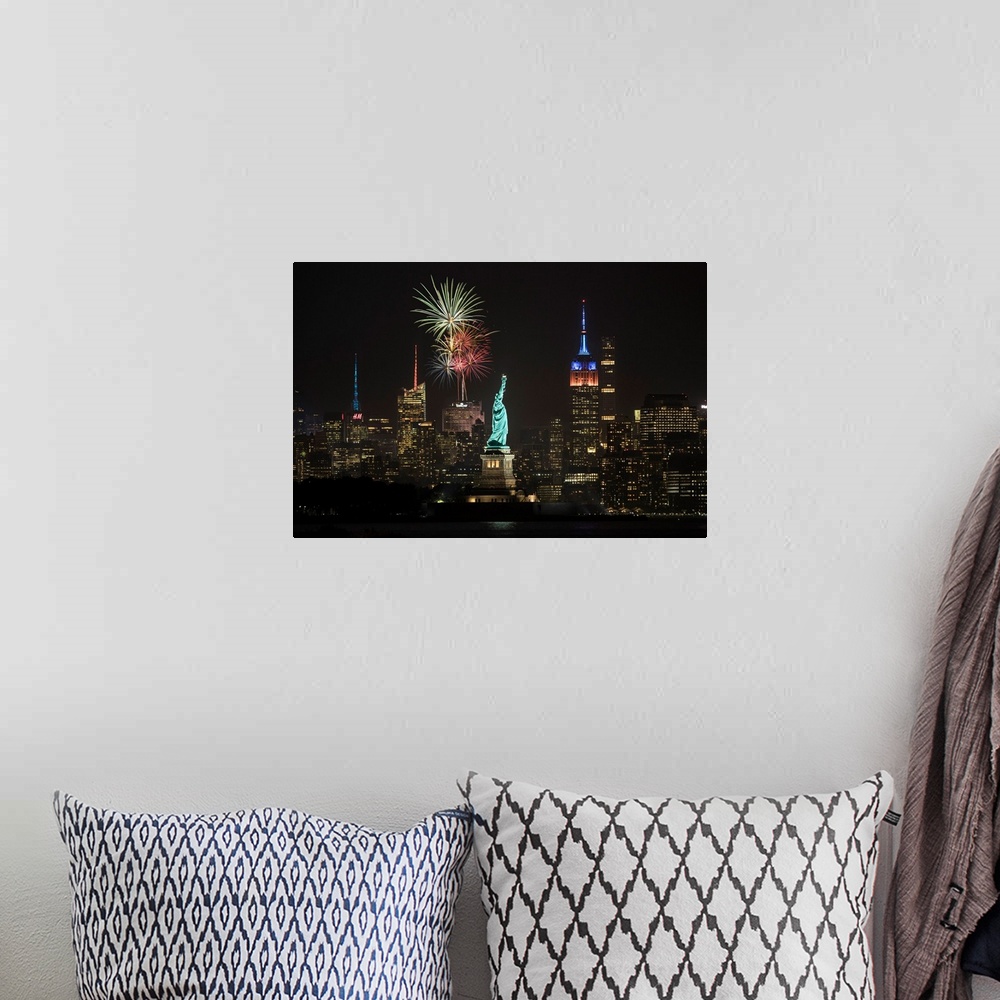 A bohemian room featuring Stature of Liberty, Empire State Building and fireworks in NYC