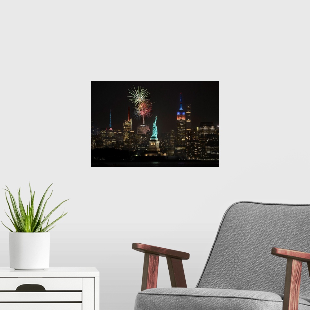 A modern room featuring Stature of Liberty, Empire State Building and fireworks in NYC