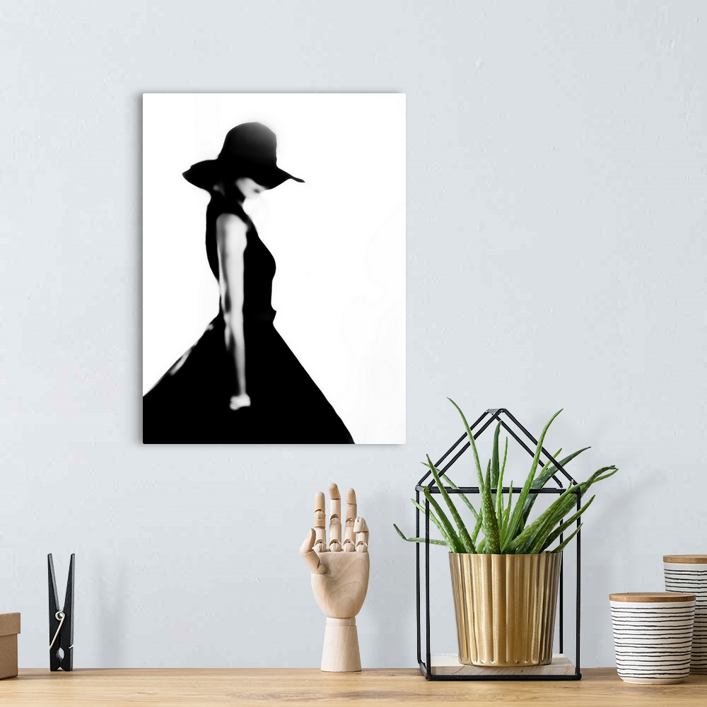 A bohemian room featuring Stylish woman in black dress